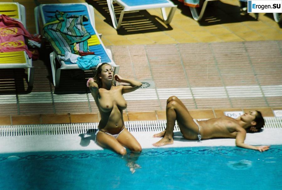 Girls sunbathe topless near the pool. Photo 5