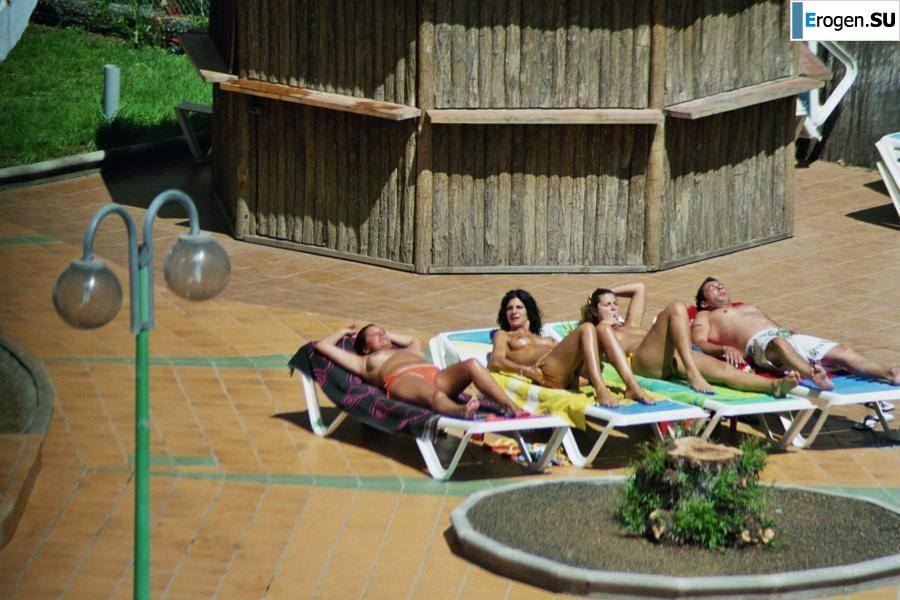 Girls sunbathe topless near the pool. Part 2. Photo 25