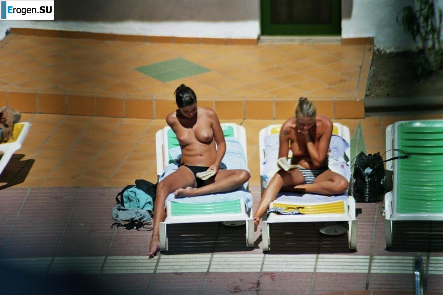 Girls sunbathe topless near the pool. Part 2. Photo 8