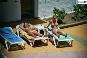 Girls sunbathe topless near the pool. Part 2. Thumb 20