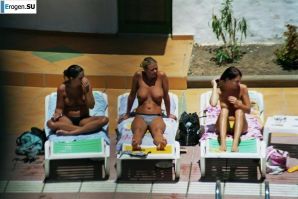 Girls sunbathe topless near the pool. Part 2. Thumb 36