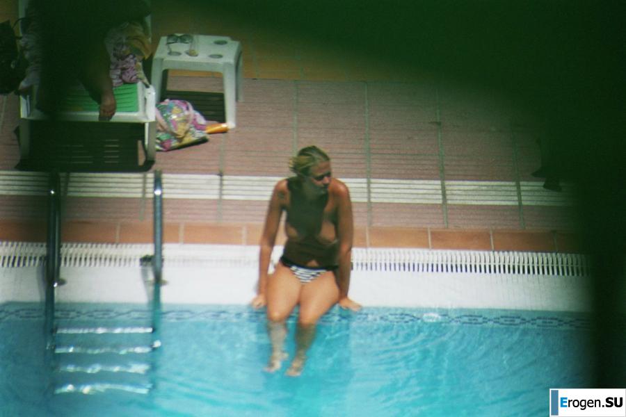 Girls sunbathe topless near the pool. Part 3. Photo 10