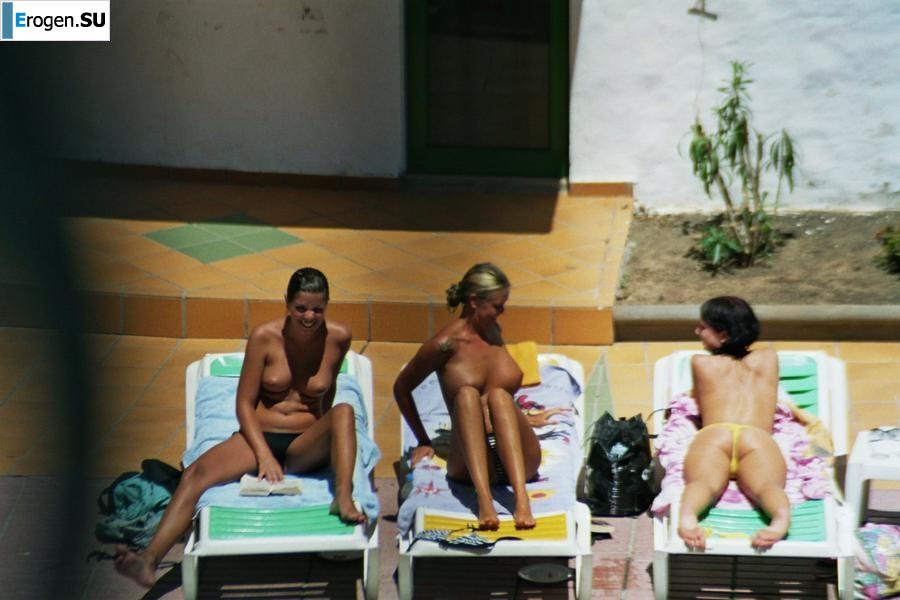 Girls sunbathe topless near the pool. Part 3. Photo 13