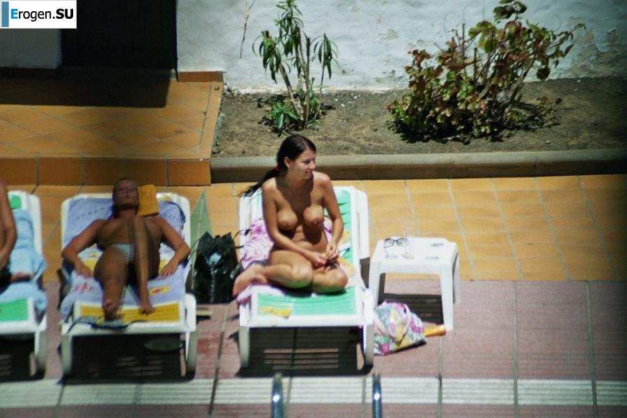Girls sunbathe topless near the pool. Part 3. Photo 15