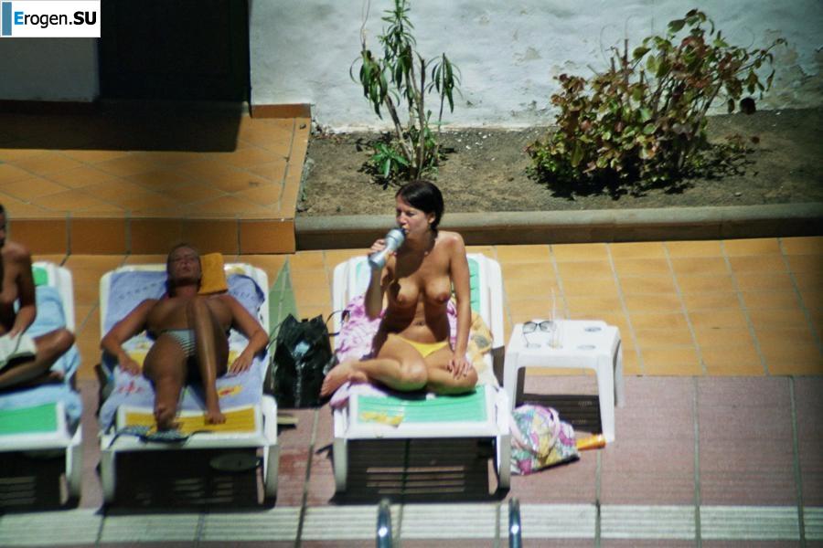 Girls sunbathe topless near the pool. Part 3. Photo 16