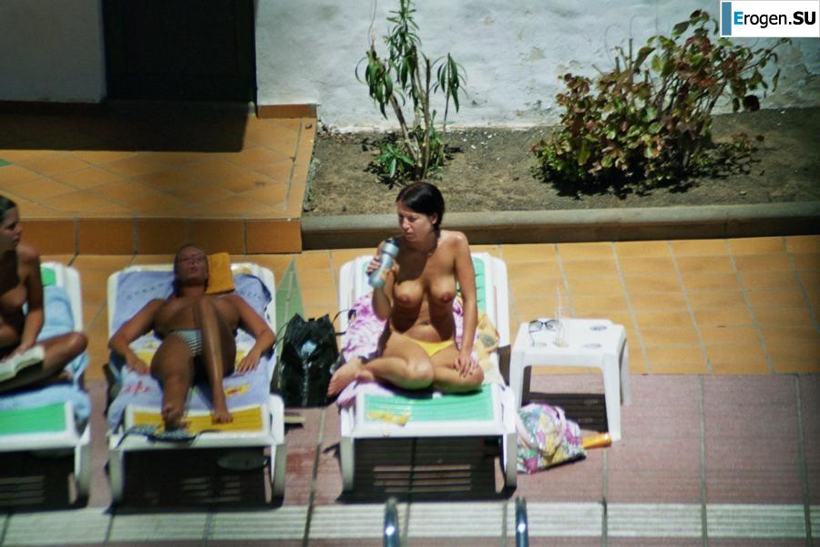 Girls sunbathe topless near the pool. Part 3. Photo 17