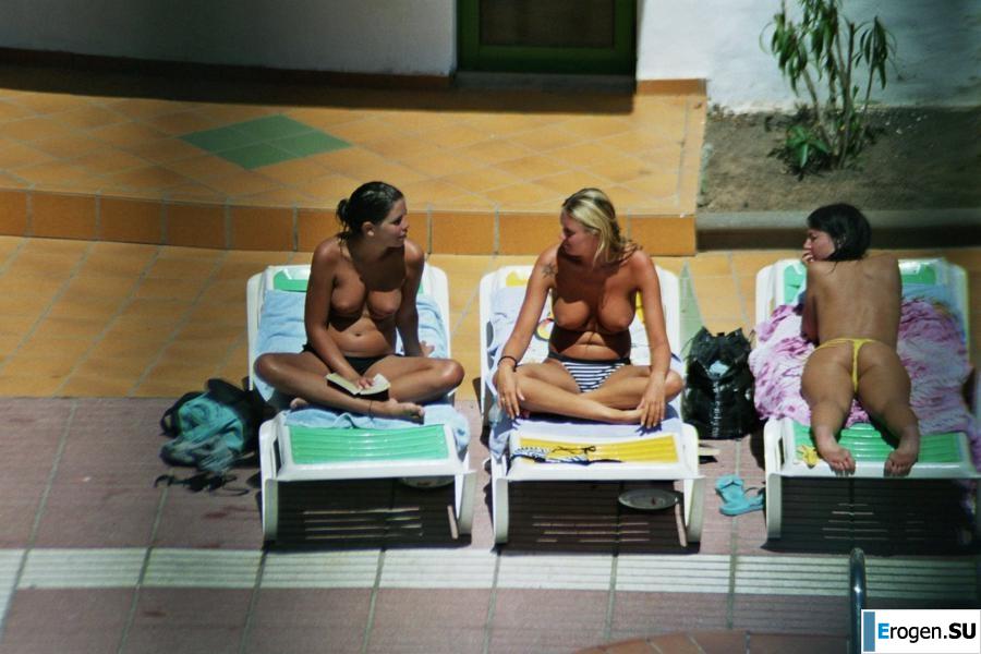 Girls sunbathe topless near the pool. Part 3. Photo 19
