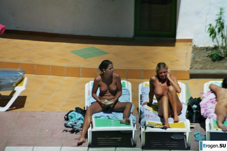 Girls sunbathe topless near the pool. Part 3. Photo 20