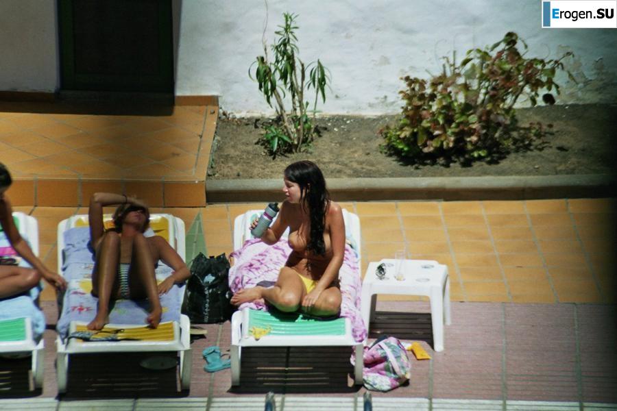 Girls sunbathe topless near the pool. Part 3. Photo 22