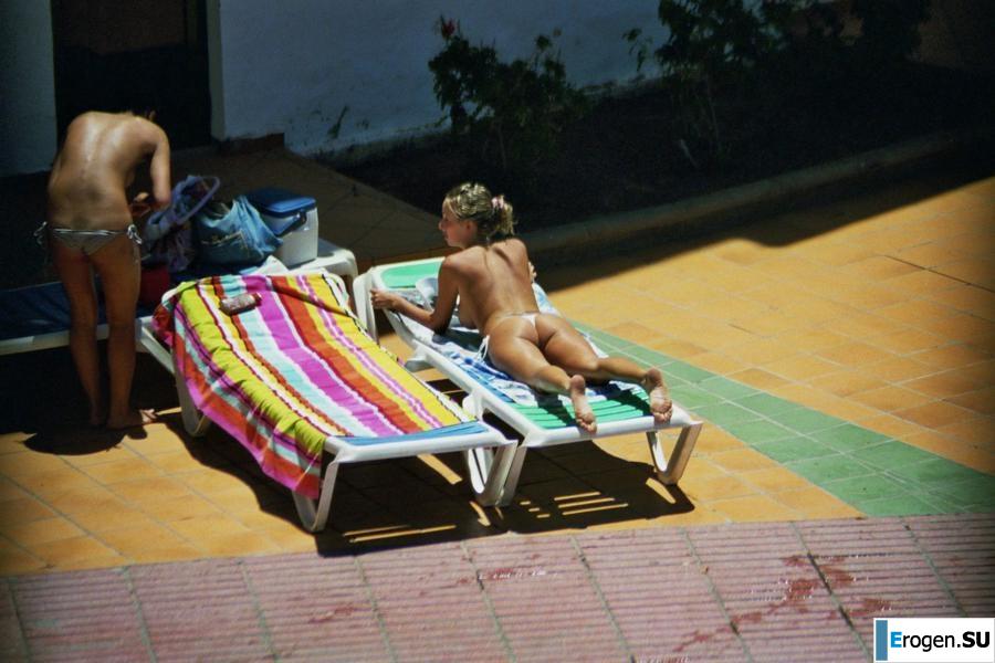 Girls sunbathe topless near the pool. Part 3. Photo 23