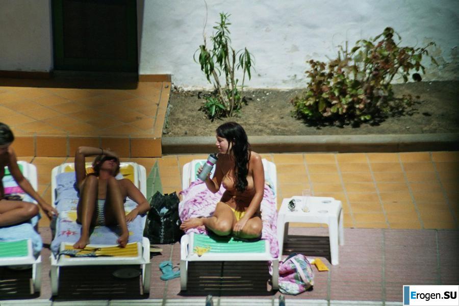 Girls sunbathe topless near the pool. Part 3. Photo 24