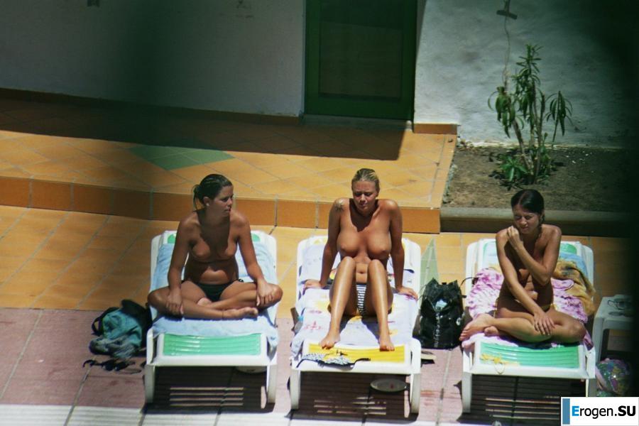 Girls sunbathe topless near the pool. Part 3. Photo 3