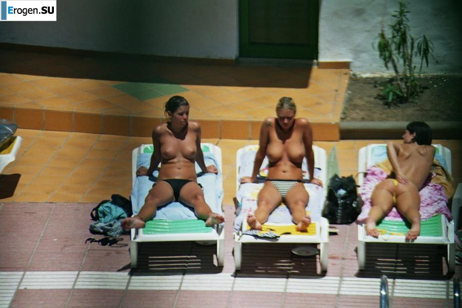 Girls sunbathe topless near the pool. Part 3. Photo 7