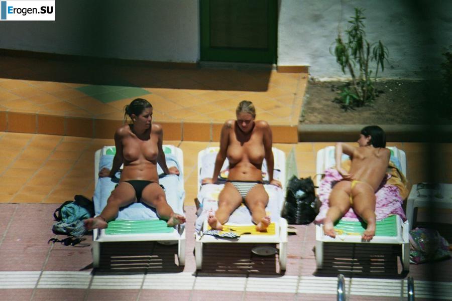 Girls sunbathe topless near the pool. Part 3. Photo 8
