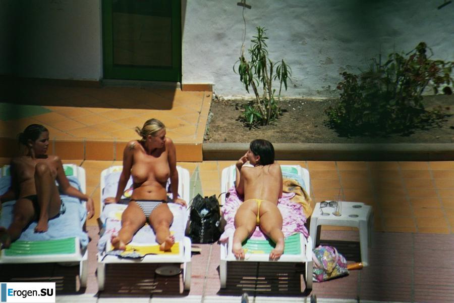 Girls sunbathe topless near the pool. Part 3. Photo 9