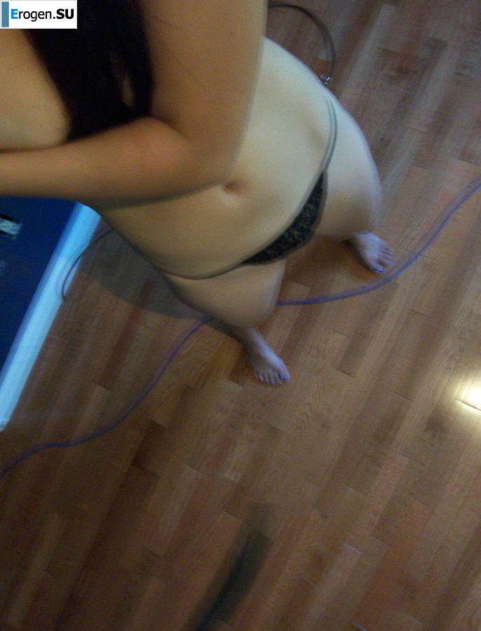 An attractive girl poses for cancer, showing her labia. Photo 10