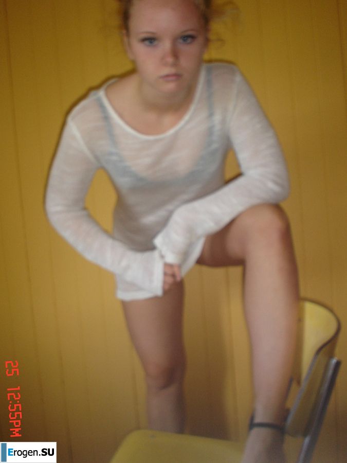 A blue-eyed minx with a pierced nipple plays with her panties. Slide 24