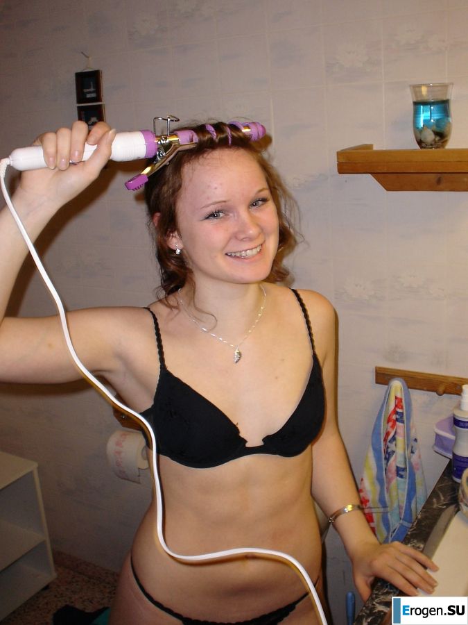 A blue-eyed minx with a pierced nipple plays with her panties. Slide 3