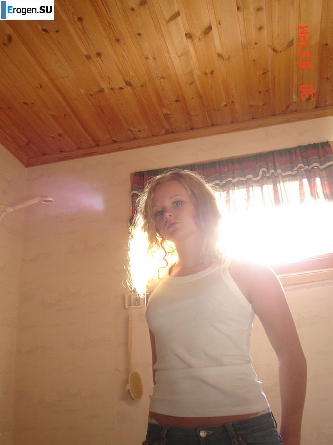 A blue-eyed minx with a pierced nipple plays with her panties. Slide 9