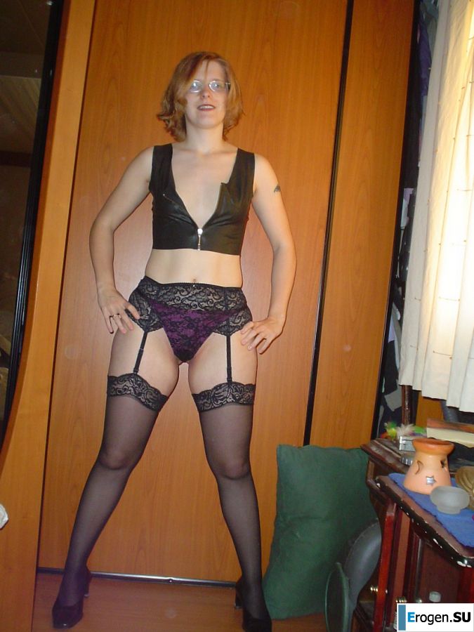 A red-haired student with glasses spread her legs in lace stockings and showed a pussy. Photo 10