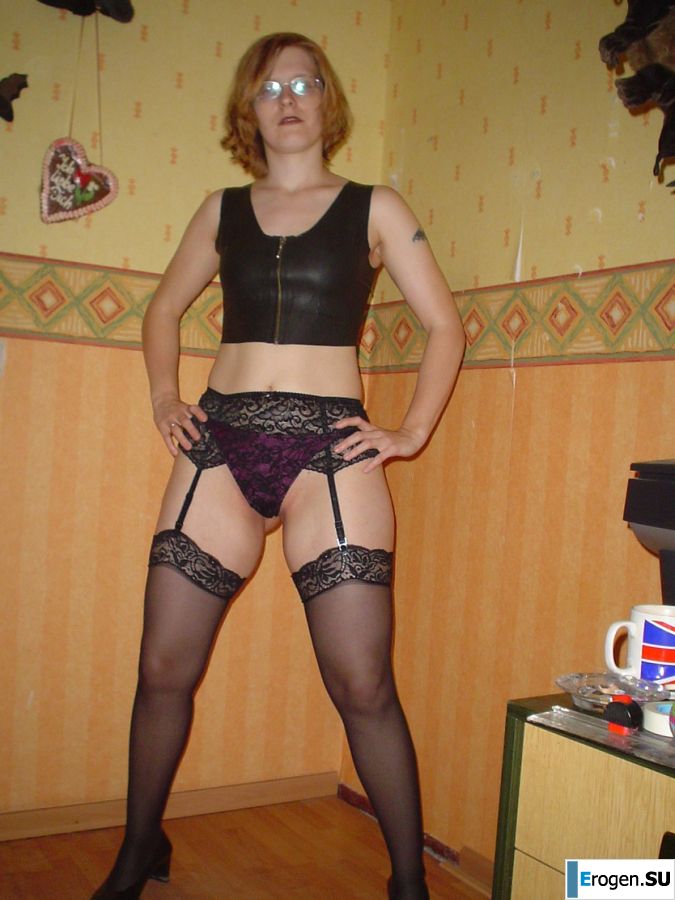 A red-haired student with glasses spread her legs in lace stockings and showed a pussy. Photo 11