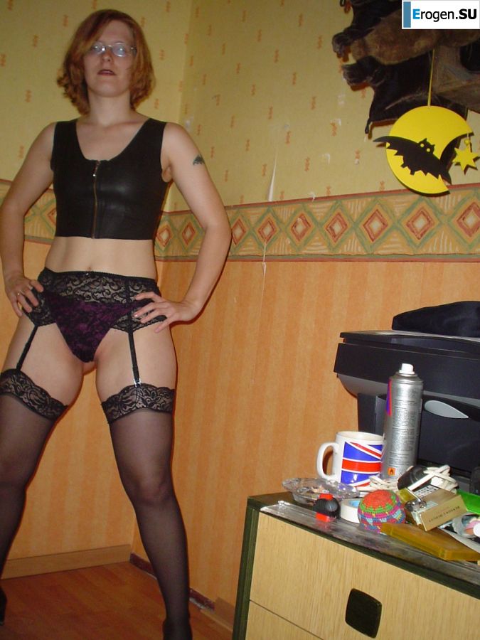 A red-haired student with glasses spread her legs in lace stockings and showed a pussy. Photo 12