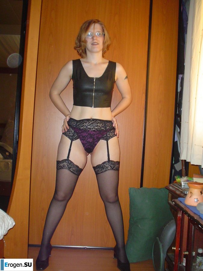 A red-haired student with glasses spread her legs in lace stockings and showed a pussy. Photo 9