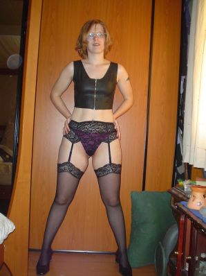 A red-haired student with glasses spread her legs in lace stockings and showed a pussy. Thumb 9