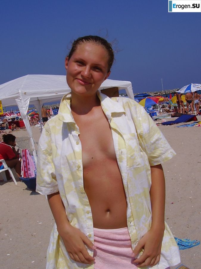 Sexy girl posing on the beach in shorts without a bra. Photo 14