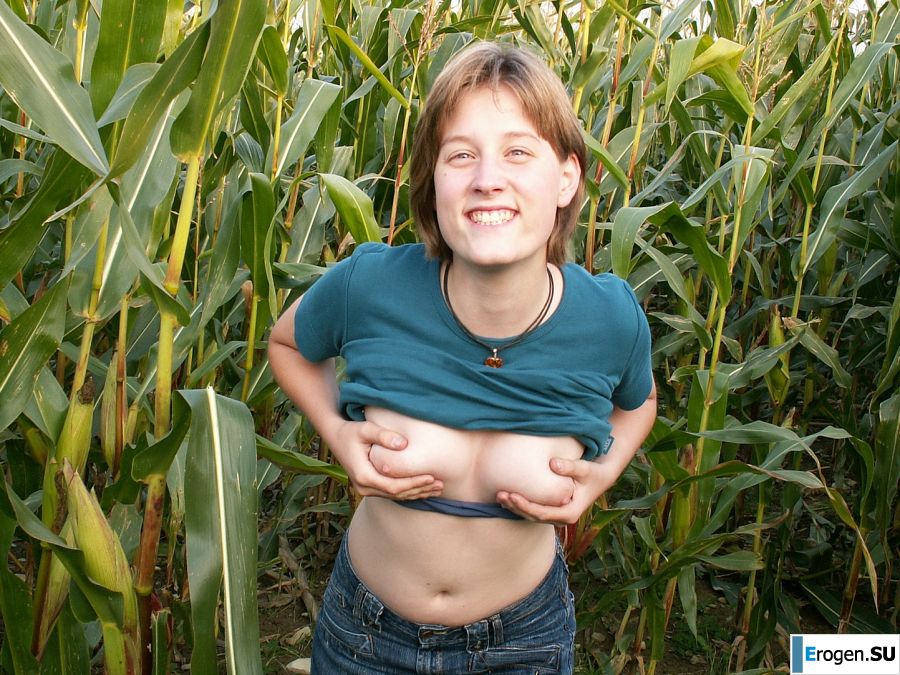 A thin student pleases herself with corn right in the field. Photo 7
