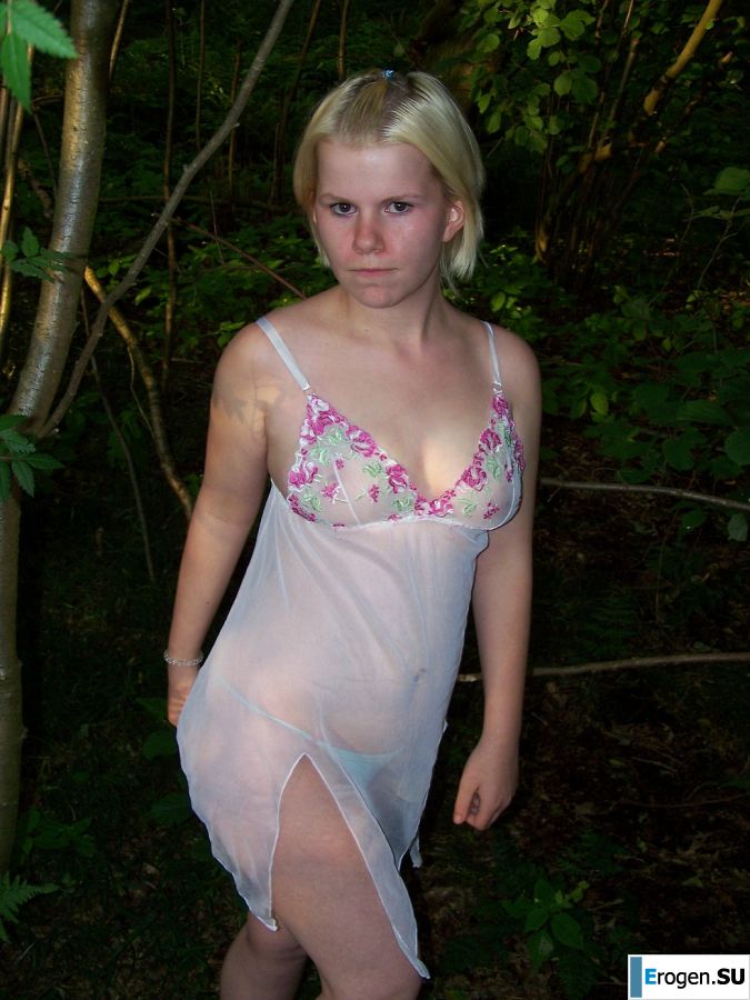 Appetizing magnificent blonde spread her legs right on the grass. Slide 10