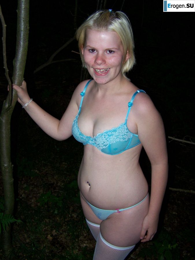 Appetizing magnificent blonde spread her legs right on the grass. Slide 23