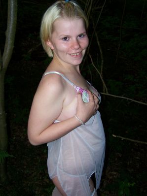 Appetizing magnificent blonde spread her legs right on the grass. Thumb 13