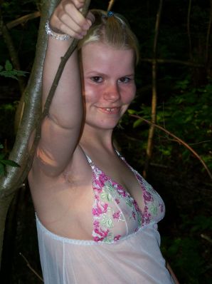 Appetizing magnificent blonde spread her legs right on the grass. Thumb 4