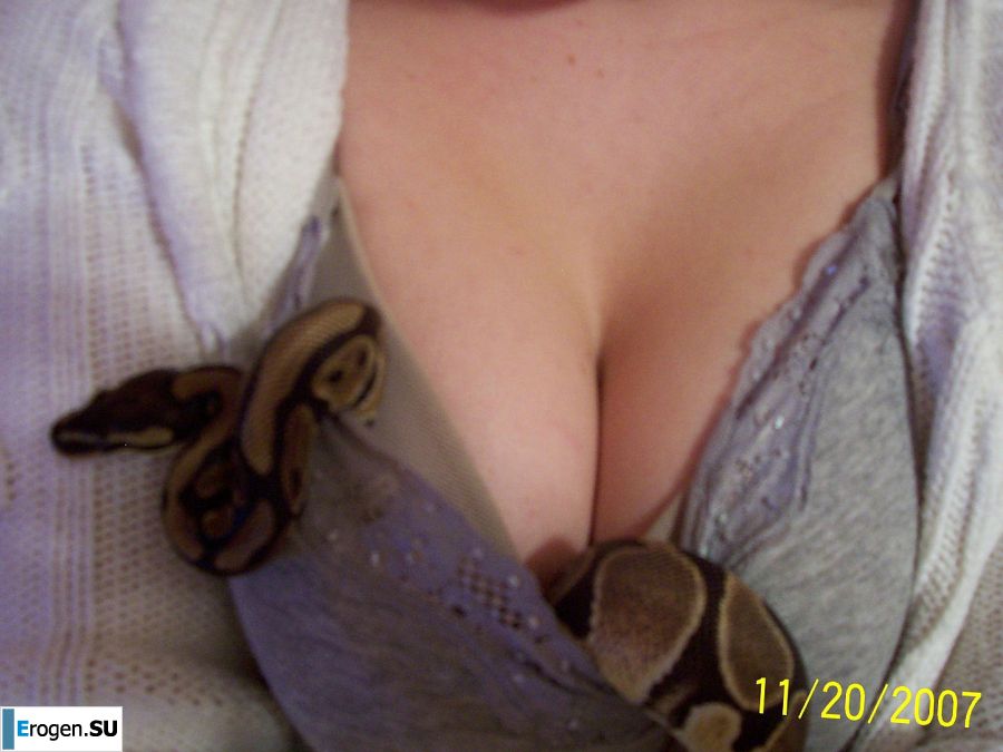 Passionate minx dances striptease in nature with a snake. Slide 41