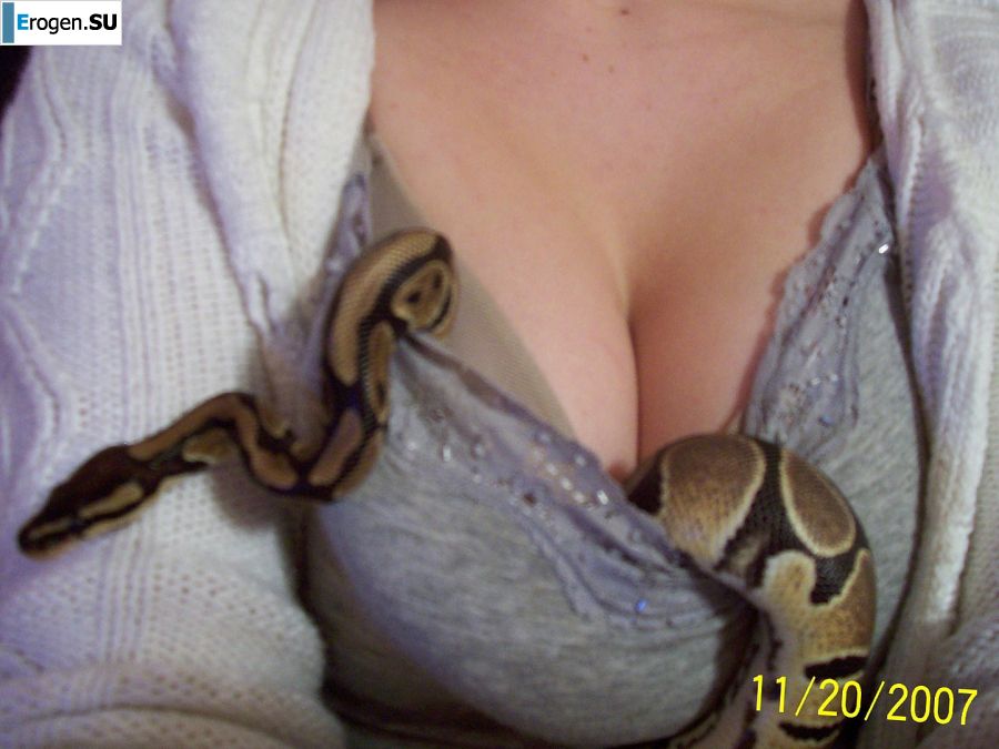 Passionate minx dances striptease in nature with a snake. Slide 42