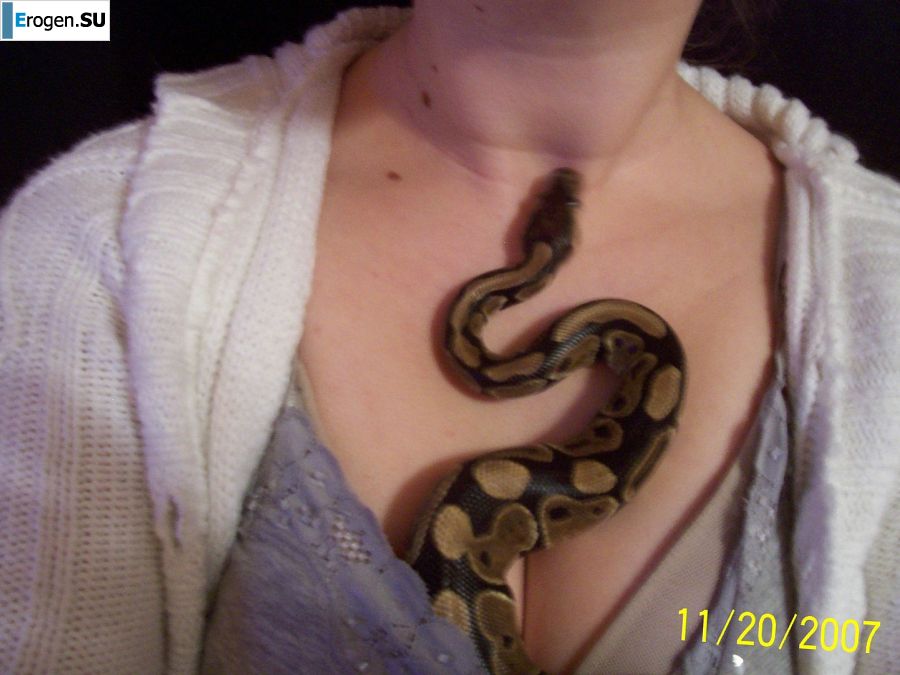 Passionate minx dances striptease in nature with a snake. Slide 44